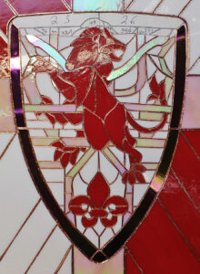 George Watsky shield stained glass close up