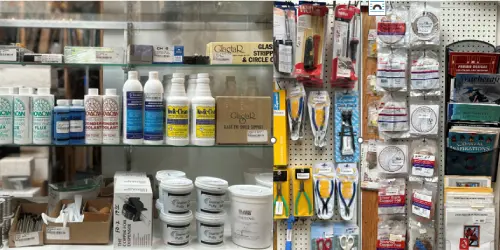 A photo of some stained glass tools and supplies organized on retail shelves.
